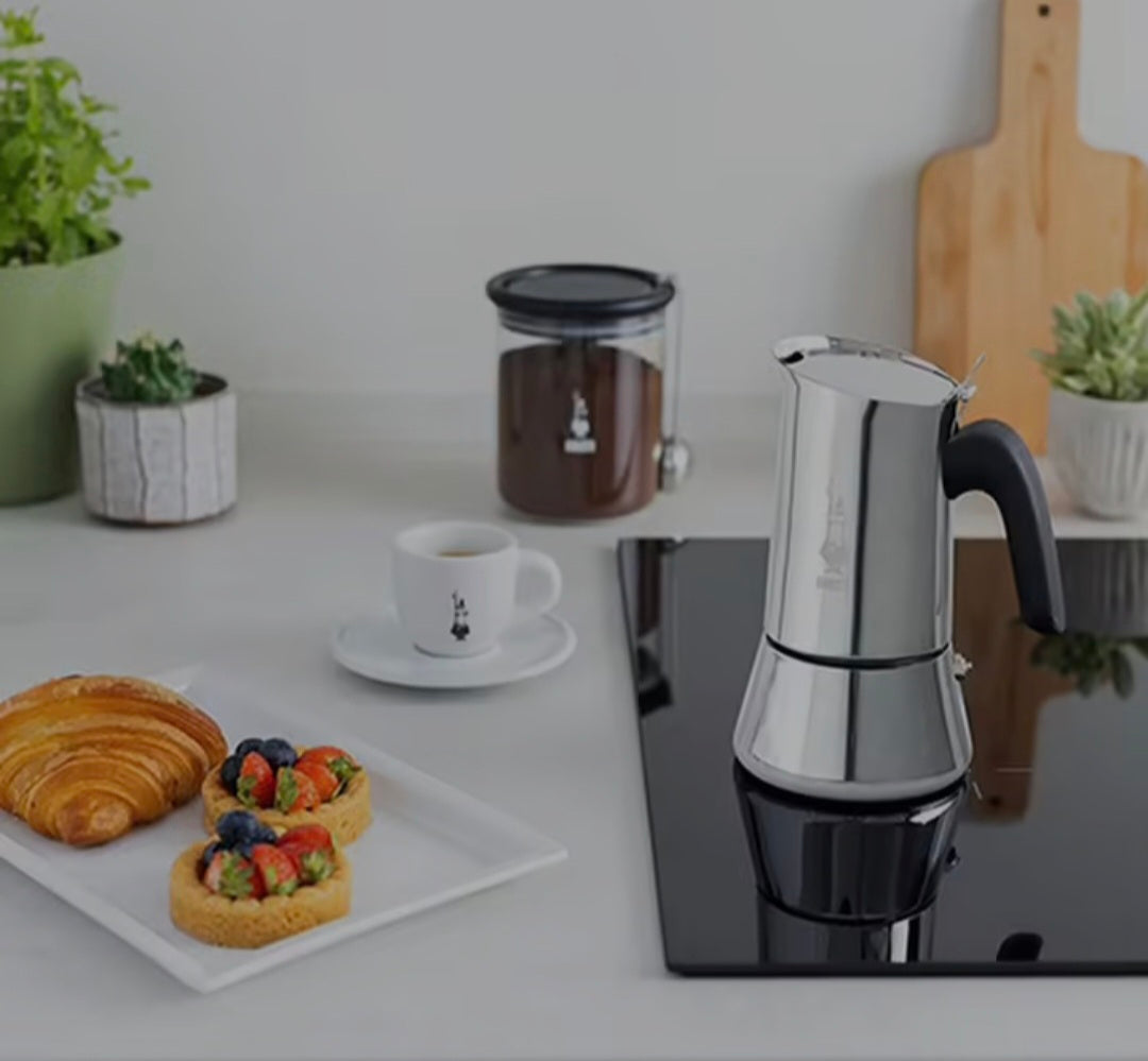 Bialetti Venus moka pot brewing espresso style coffee on stovetop with even heat distribution stainless steel body